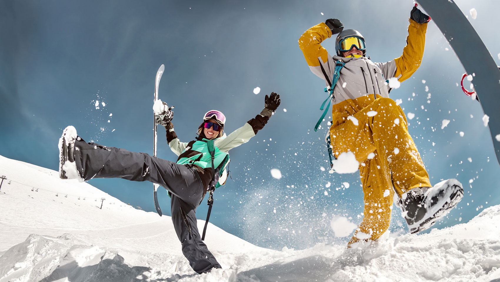 Happy skiers playing in snow