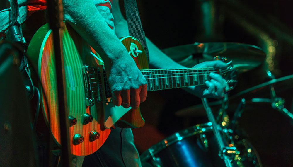 close-up of guitarist