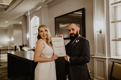 Couple Holding Marriage Certificate