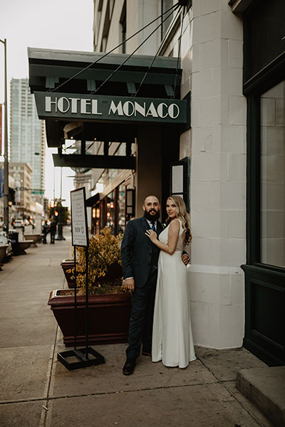 Couple in front of Hotel Monaco Denver