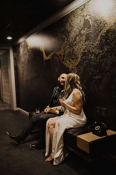 Couple in front of mural